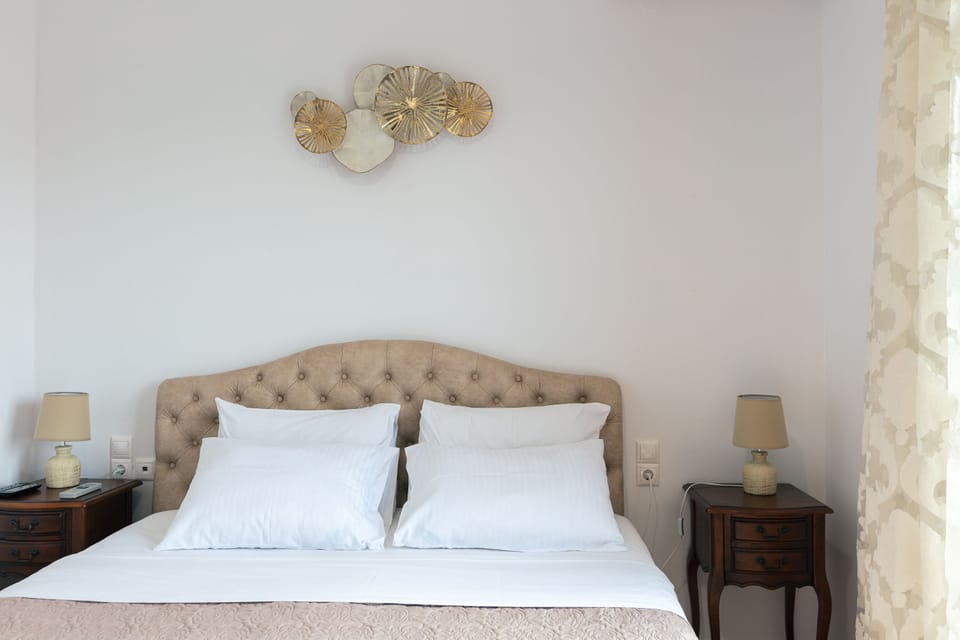 The master double bedroom features a queens bed with access to a balcony.