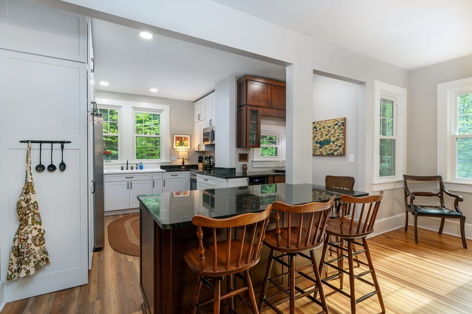 All new kitchen and appliances on the main level with bar seating for 3, dishwasher, and libation station.