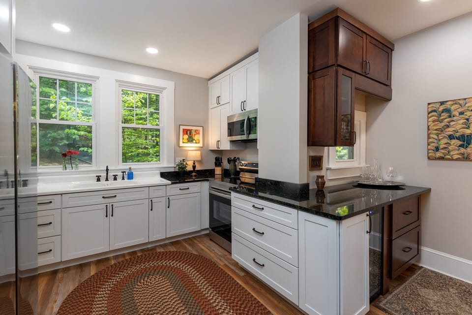 All new kitchen and appliances on the main level with bar seating for 3, dishwasher, and libation station.