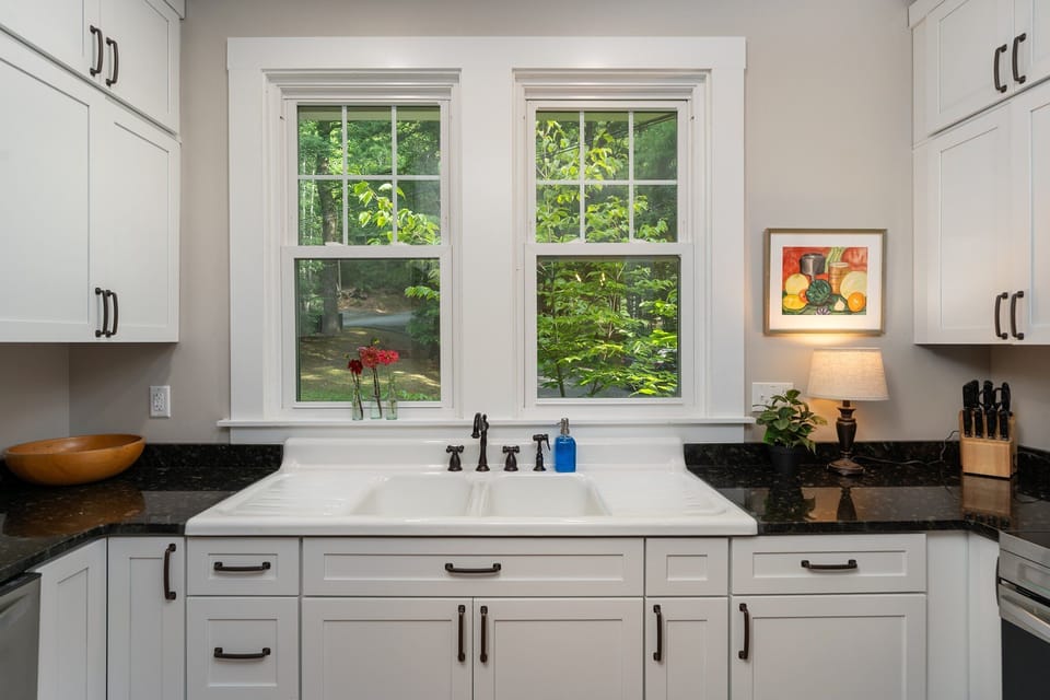 All new kitchen and appliances on the main level with bar seating for 3, dishwasher, and libation station.