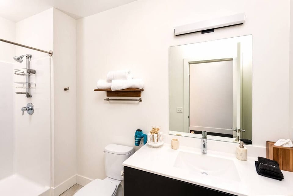 Elevate your routine with high-end fixtures and a modern shower designed for a crisp, clean start to your day