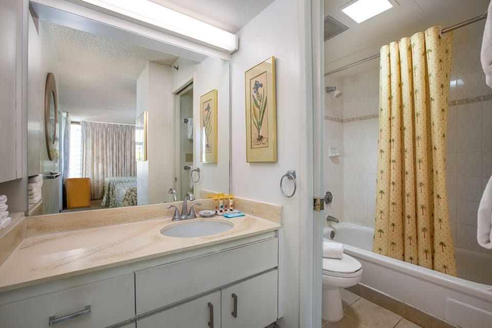 Step into your bright, freshly updated bathroom with a full tub-shower combo and plenty of counter space to unpack and unwind after a day of adventure.
