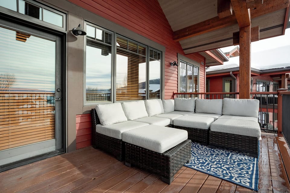 Unwind on your private terrace with plush seating and scenic views through expansive windows.