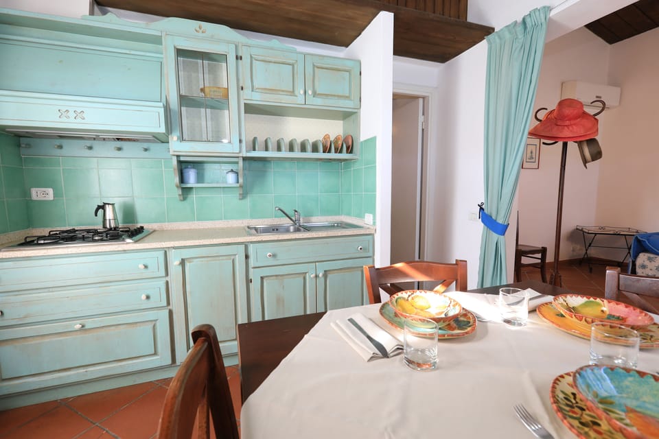 Apartment, 2 Bedrooms | Private kitchen | Fridge, stovetop, griddle, cookware/dishes/utensils