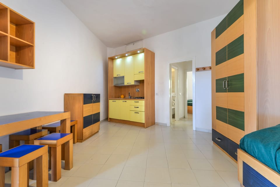 Apartment, 1 Bedroom | Living area | 32-inch TV with satellite channels