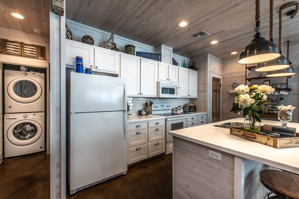Kitchen with stacked laundry