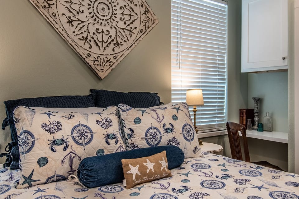 Desk area by the queen bed