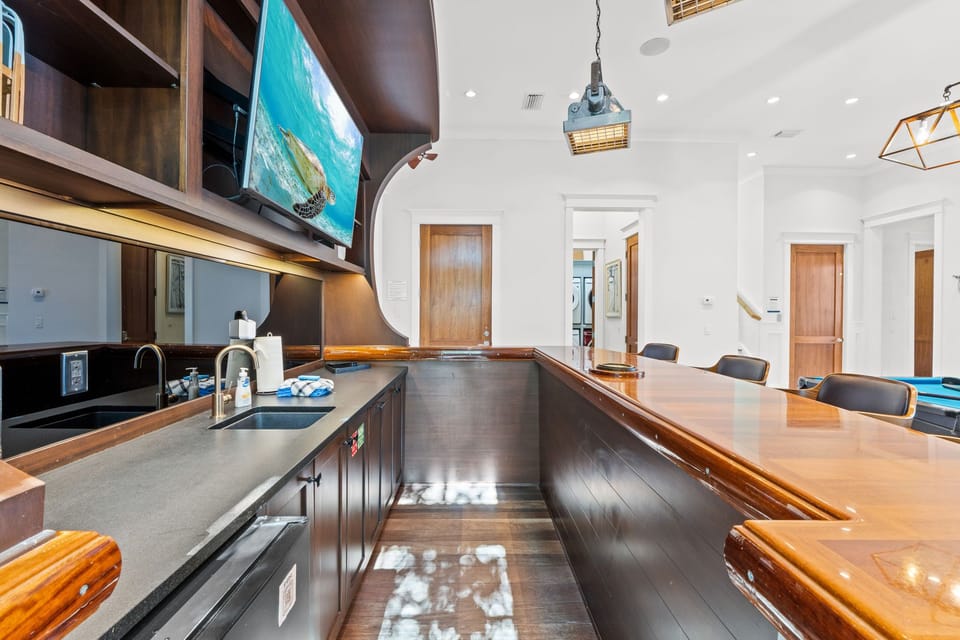 Built-in bar area with seating in the game lounge