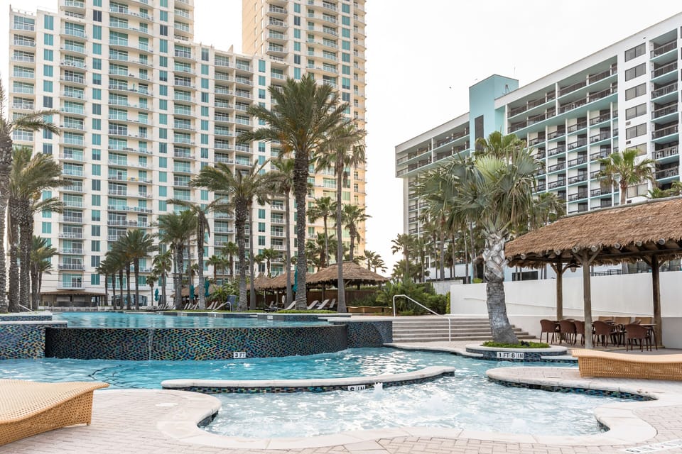 When you're not in the pool or on the sand, you can enjoy a bit of shade in the tropical, pool-side palapas.