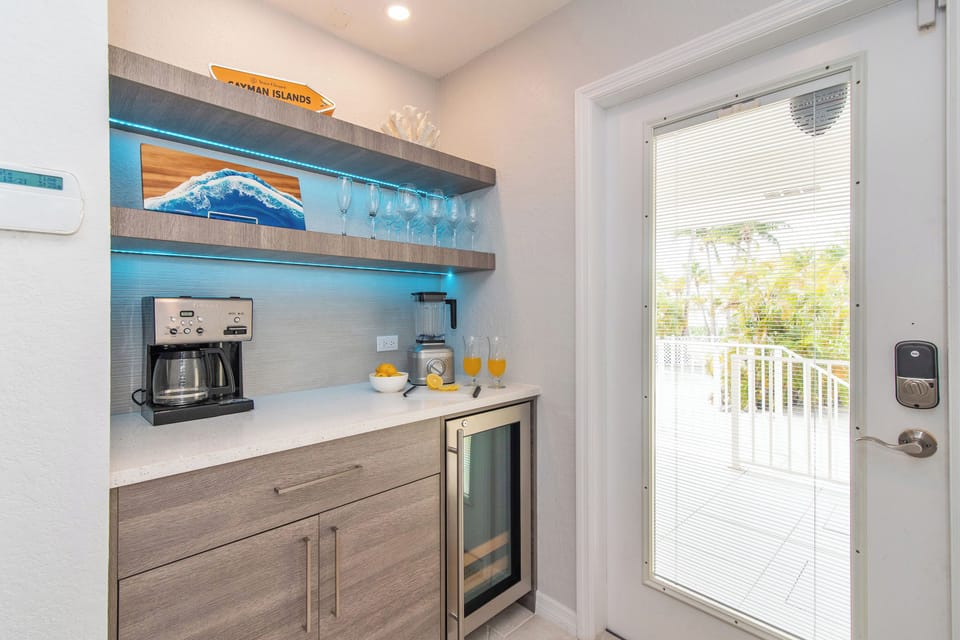 Wet bar with coffee machine and blender. 