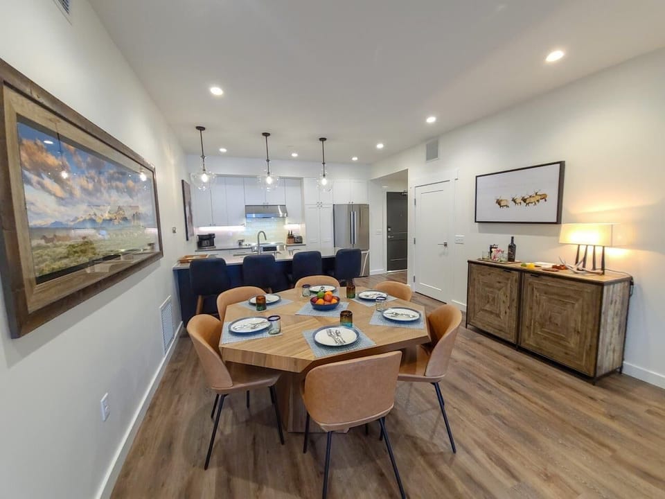 Open concept living, dining and kitchen areas.