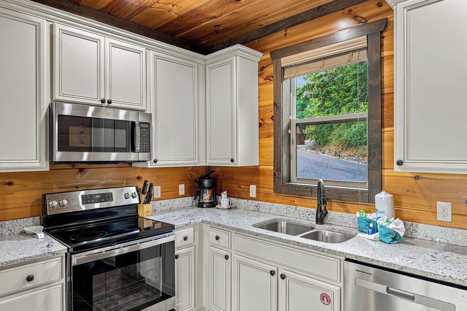 Fully equipped kitchen with stainless-steel appliances.