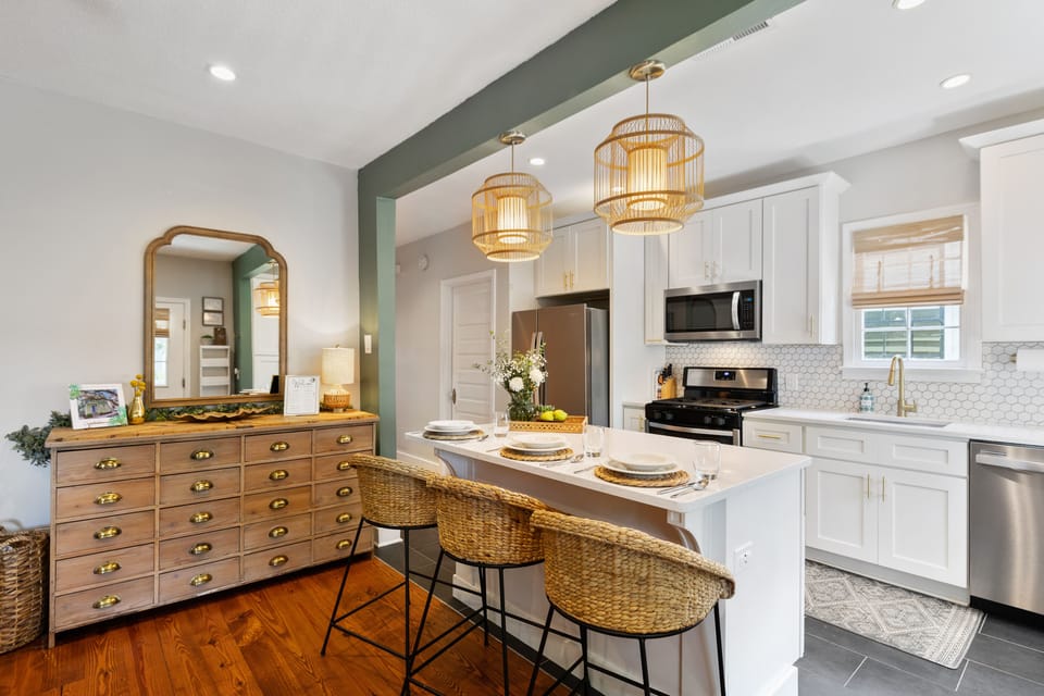 Fully stocked chef's kitchen opens to living room and balcony