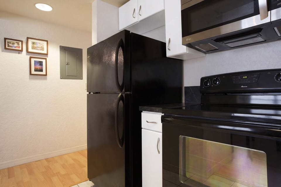 Enjoy cooking in this compact Airbnb kitchen with modern appliances—ideal for travelers who love to dine in.