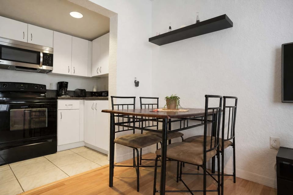 Cook and dine with ease in this well-equipped Airbnb kitchen and dining space—perfect for long stays or weekend trips.