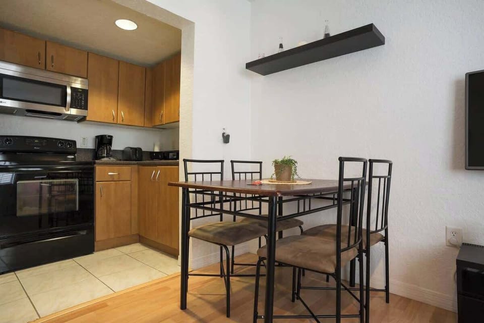 Cook and dine with ease in this well-equipped Airbnb kitchen and dining space—perfect for long stays or weekend trips.

