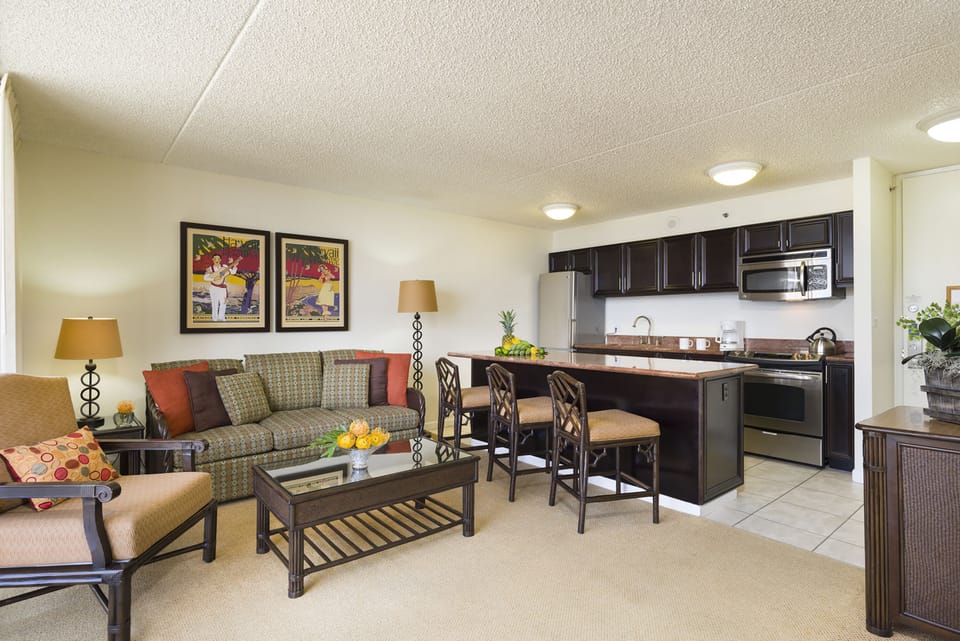 Settle into your welcoming suite, where a fully-equipped kitchen with granite counters meets a comfortable living space—perfect for unwinding after island adventures.