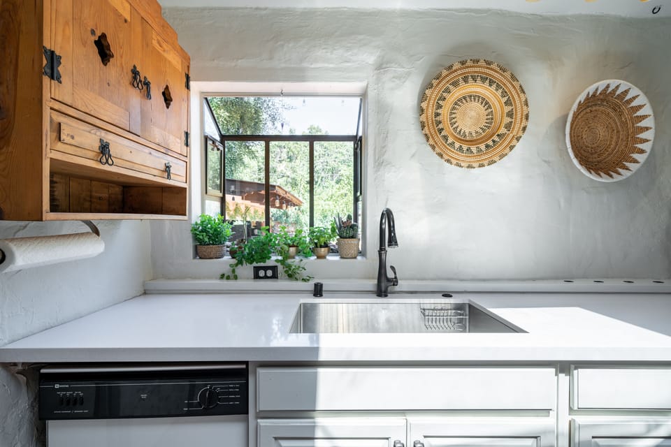 Garden window and skylight above provide beautiful natural lighting. Dishwasher.