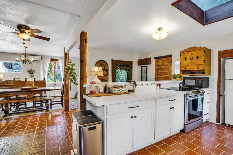 Open floor to dining room, coffee & tea station, fully stocked kitchen.