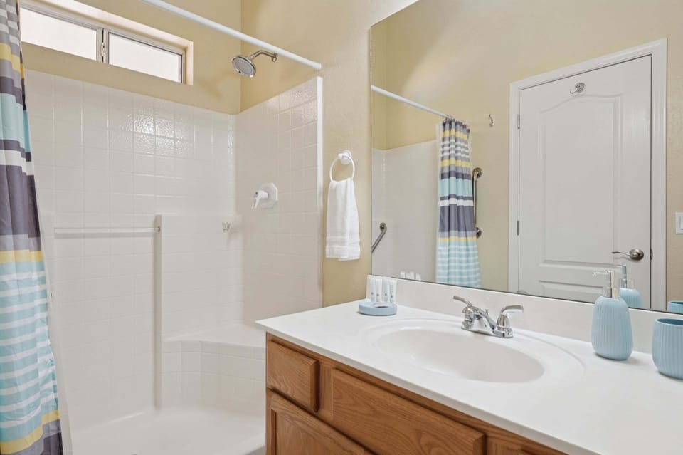 Guest Bathroom featuring a modern stand-up shower for convenience and ease