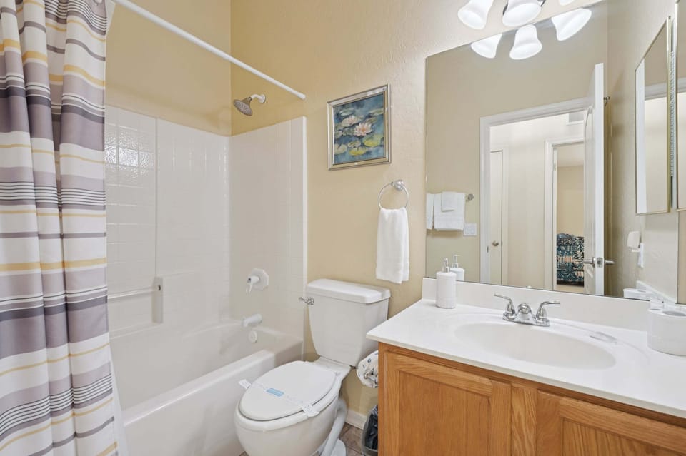 Full bathroom with clean tub/shower combo which offers both comfort and convenience
