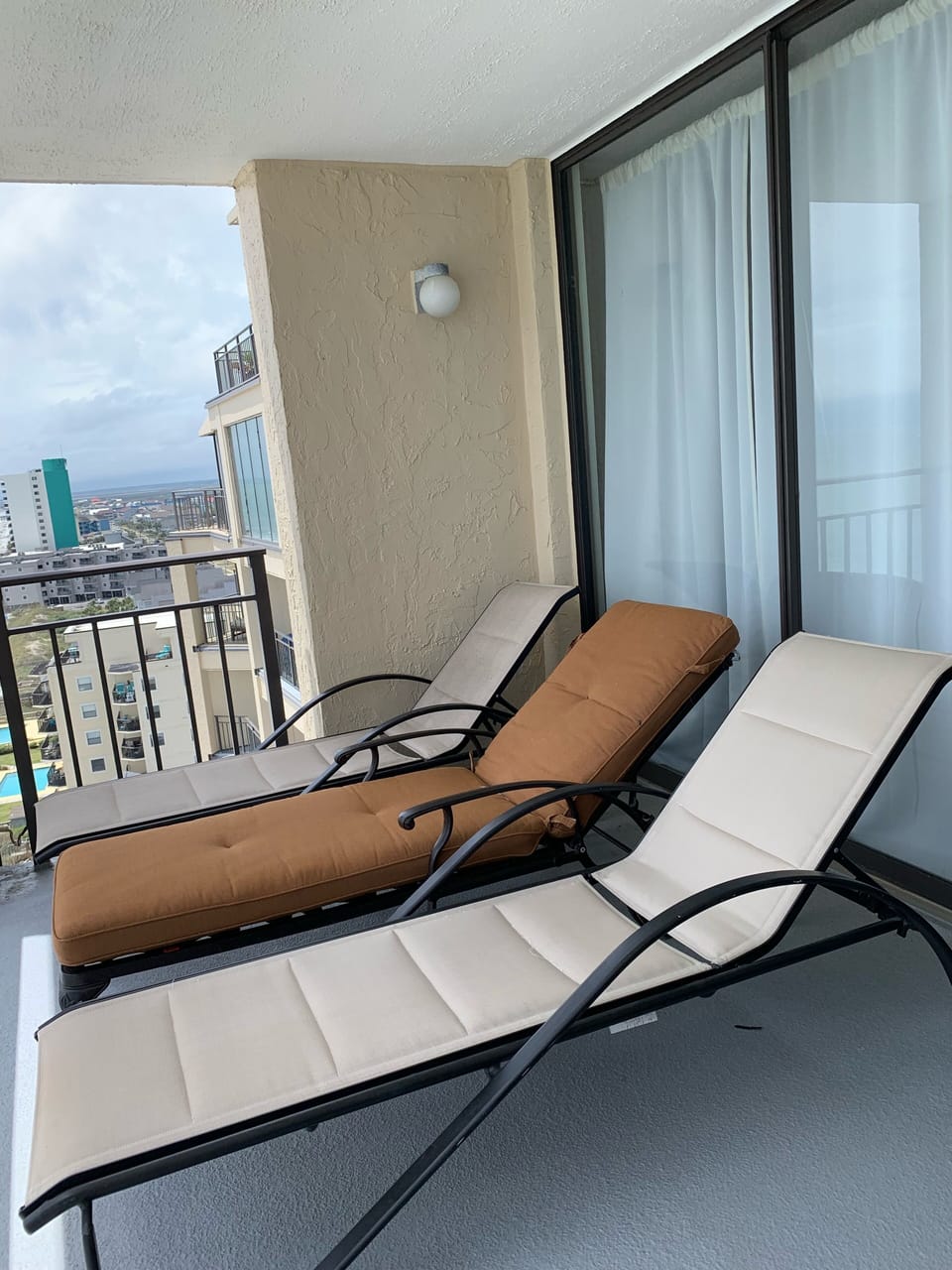 Balcony; lounge chairs