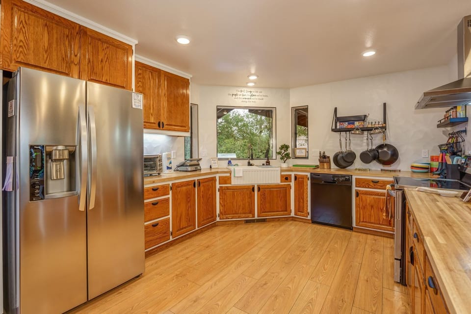 Kitchen with all the necessities and cook-wear to make any meal.
