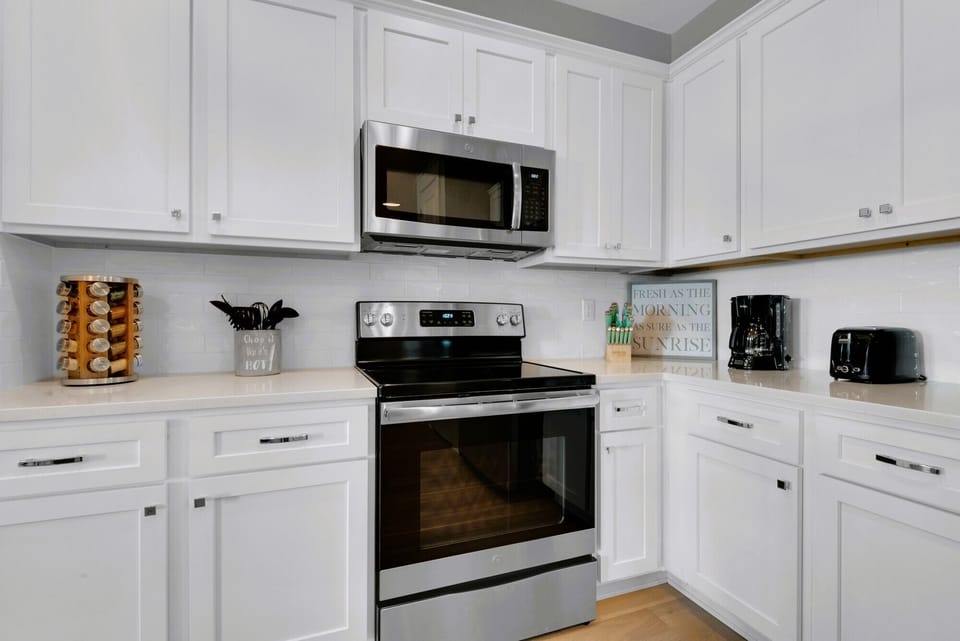 Spice rack, utensils, toaster, drip & Keurig coffee maker.