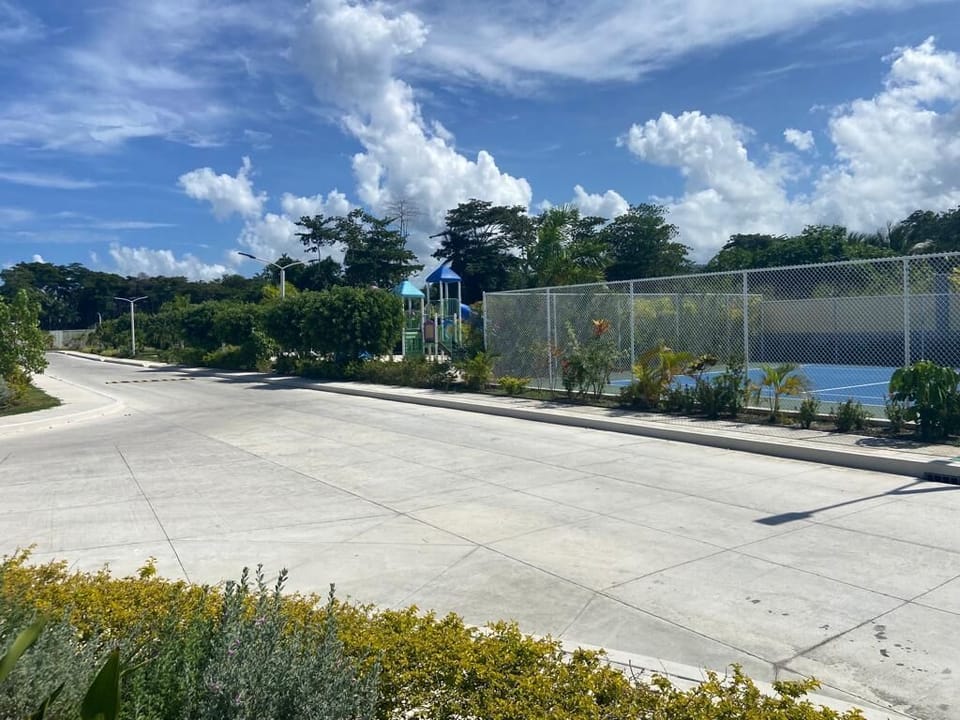 Tennis court and playground area