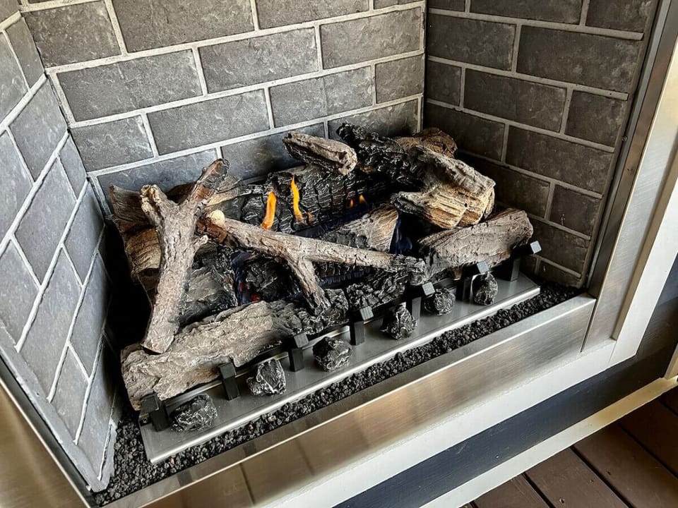 Take the chill off the evening with the gas fireplace on the back porch.