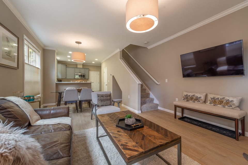 View of the open living and  dining areas.  Bench can be used at dining table.