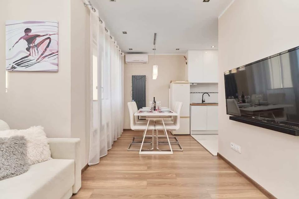 Watch your favorite shows on the flat-screen television in the elegant living area.