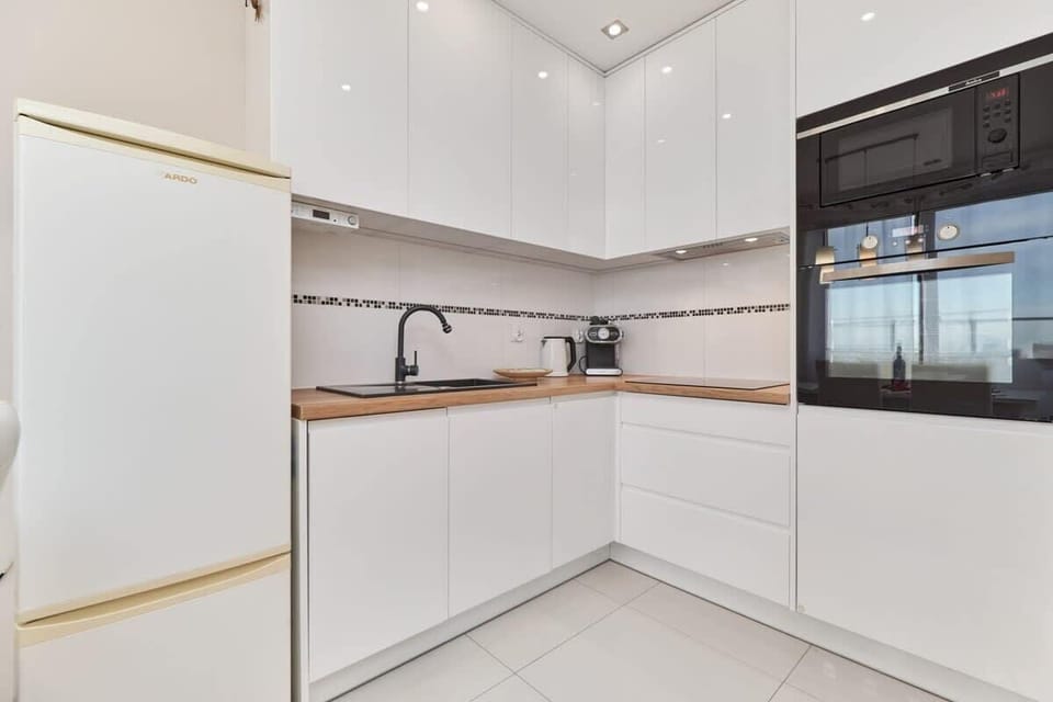 The fully equipped kitchenette includes everything you need for a home-cooked meal.