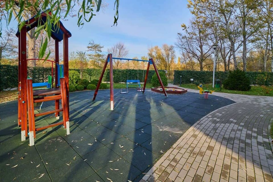 The building is situated near public parks and green spaces. 