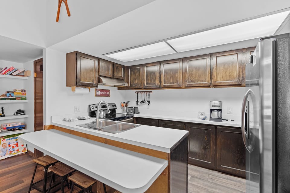 Full size kitchen with stainless steel appliances.