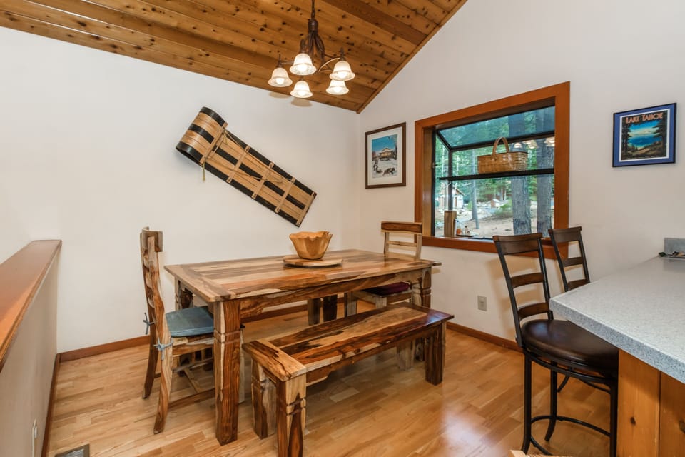 Dining Room With Natural Wood Table & 2 Bar Seats