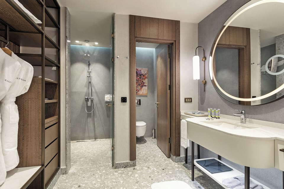 Designer toiletries, hair dryer, bathrobes, slippers