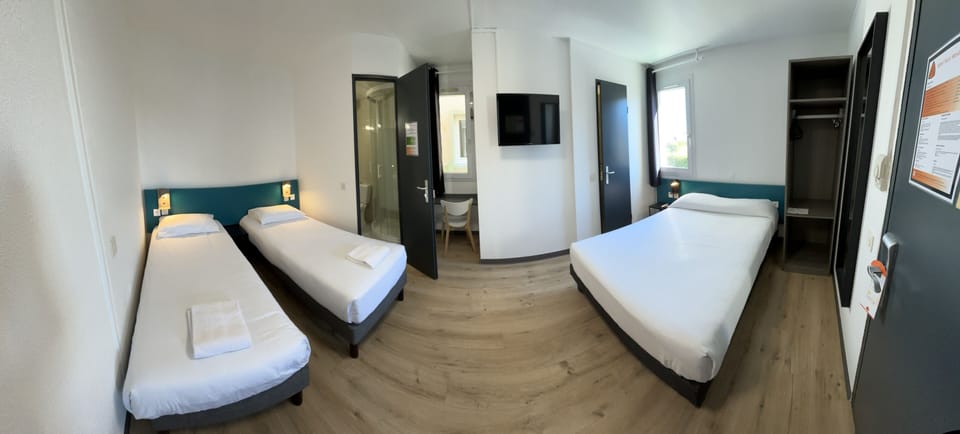 Family Room | Down comforters, desk, blackout drapes, soundproofing