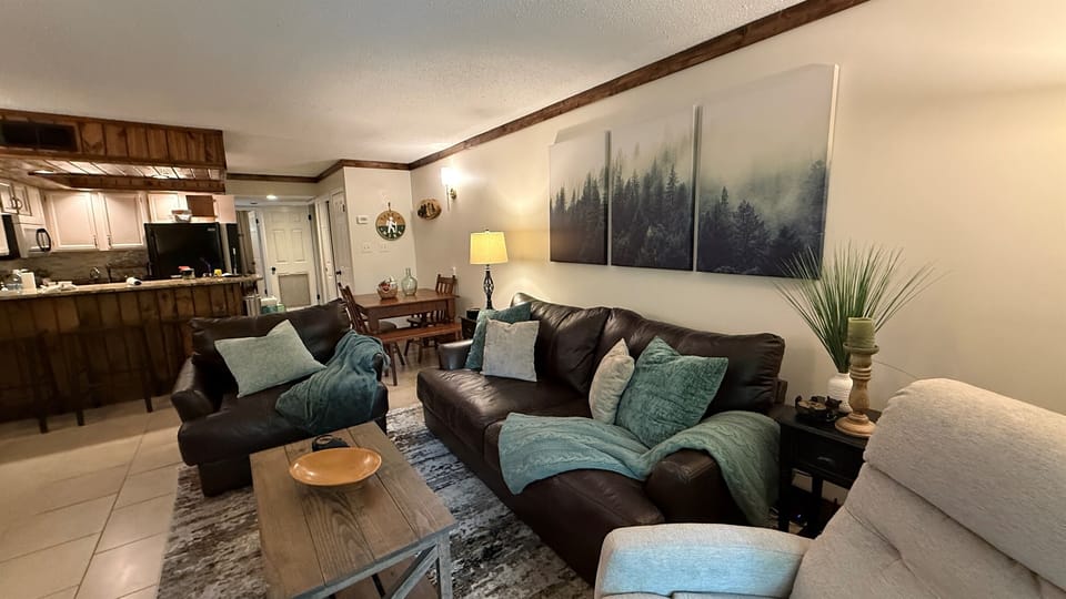 The comfortable living room will make you feel right at home as you ease back into the oversize couch or chair and snuggle up with one of the soft throws.  Get comfortable and turn on your favorite streaming site.