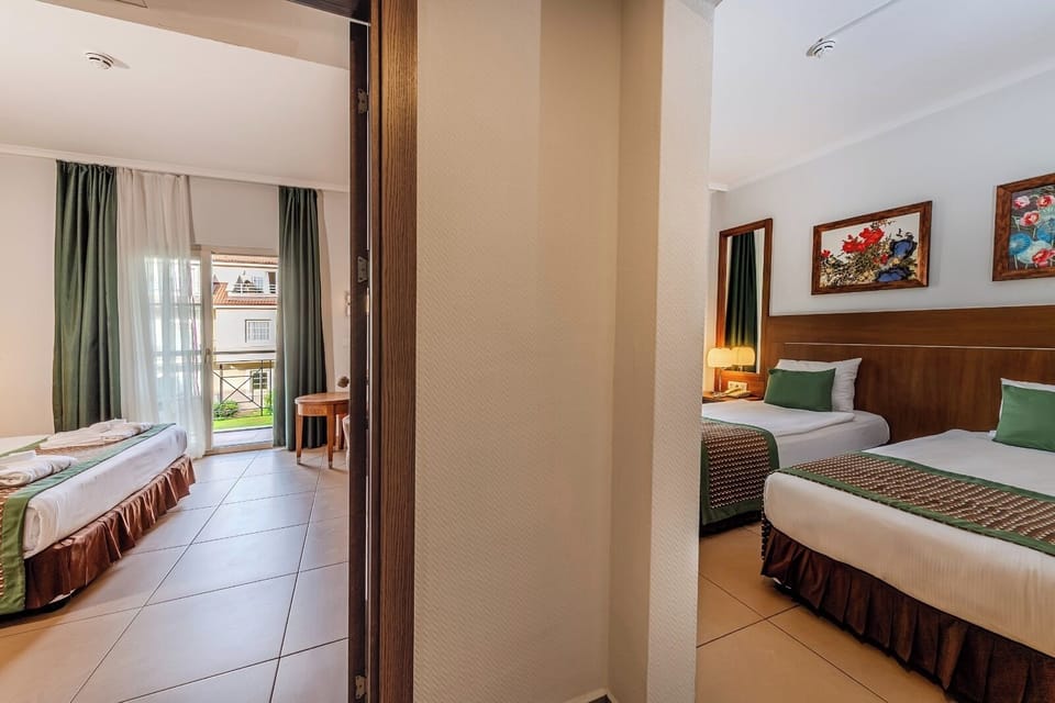 Club Quadruple Room, Garden View | Premium bedding, minibar (free items), in-room safe, desk
