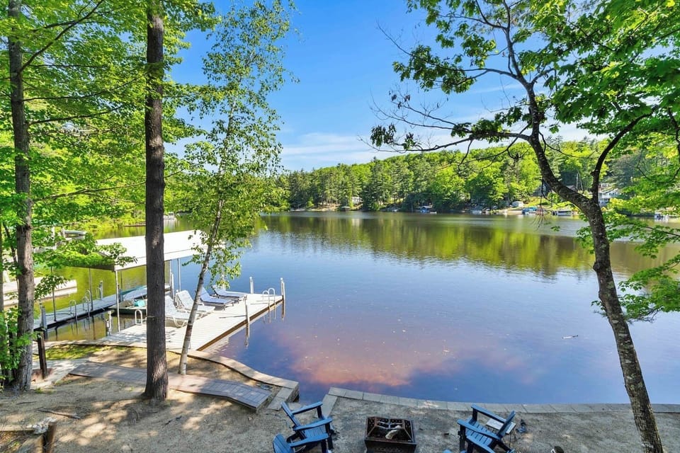 view of the beach, dock, lake and fire pit!