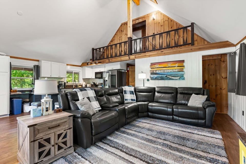Open concept main living area with fantastic lake views and 70 inch smart TV