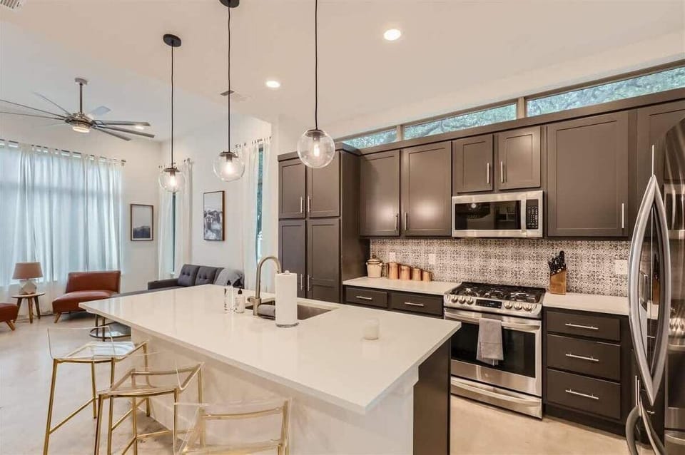 3 Bar Stools, Microwave, Oven, Stove, and plenty of cabinet space for a longer stay :)