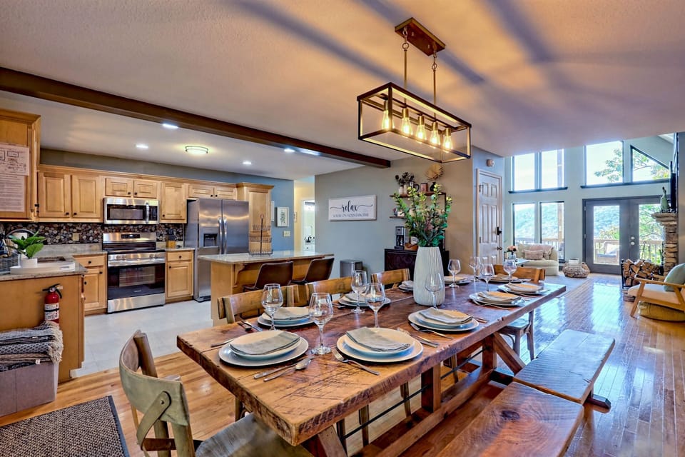 Dine together at the farmhouse table for 10, grab a quick bite at the kitchen island seating 2, or enjoy the living room table for 4—ample space for everyone to gather and connect