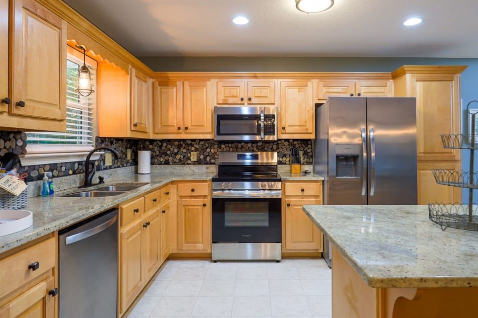Enjoy the option to cook your own meals or hire a personal chef to create a culinary experience in this fully equipped kitchen with modern appliances and plenty of space to gather and savor.