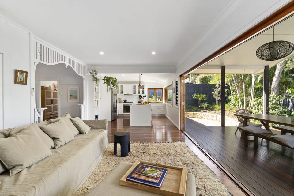 Open plan living situated at the back of the house leading to the outside area. 