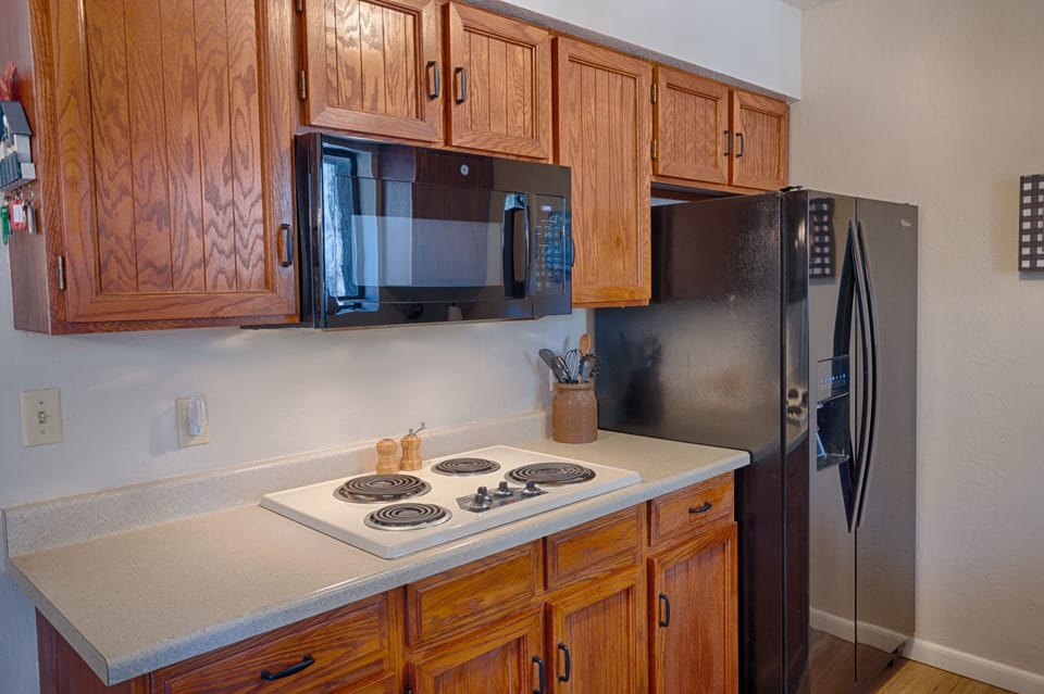 Cozy kitchen with microwave and fridge with filtered water & ice.