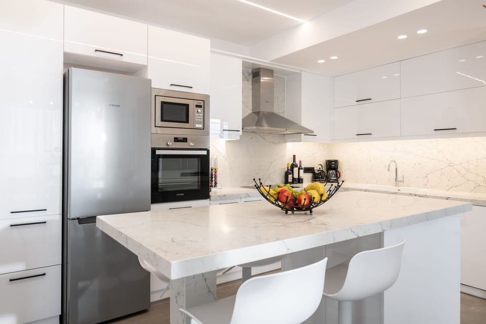 The bright chalky kitchen is the perfect spot to cook new recipes.