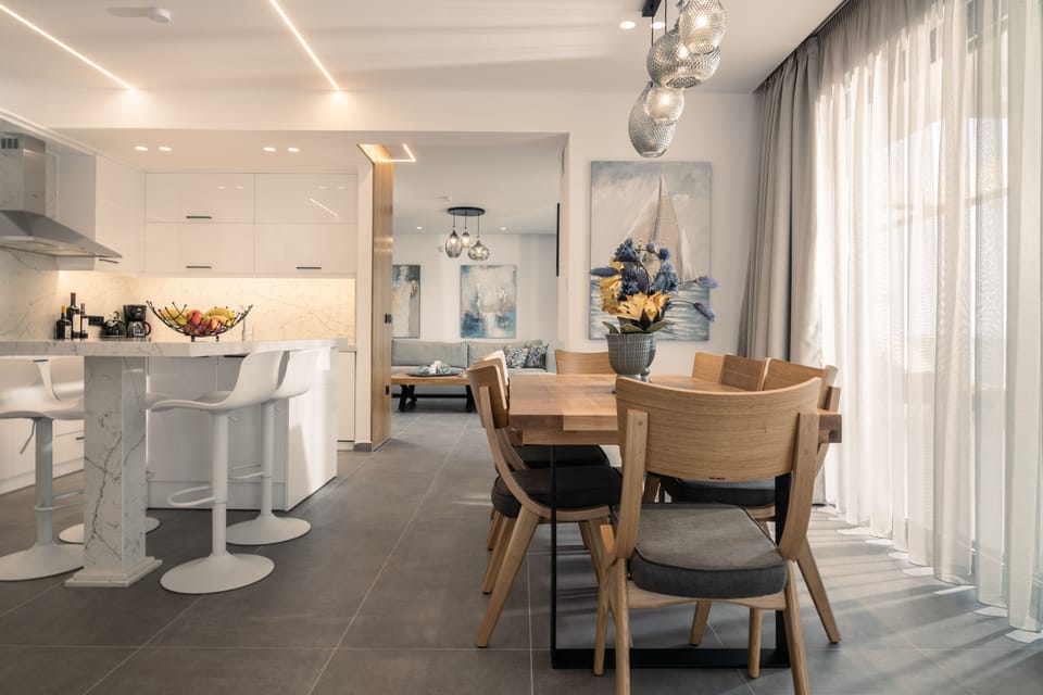 The open plan living room features a kitchen island and dinning spot.