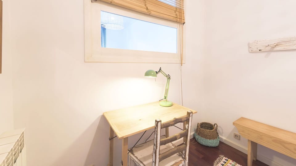 A cozy dedicated workspace bathed in natural light, perfect for catching up on emails or planning your next adventure. The rustic charm of the desk and chair invites quiet contemplation. 
#WorkspaceGoals #NaturalLight #RusticCharm #HomeOffice #QuietCorner
